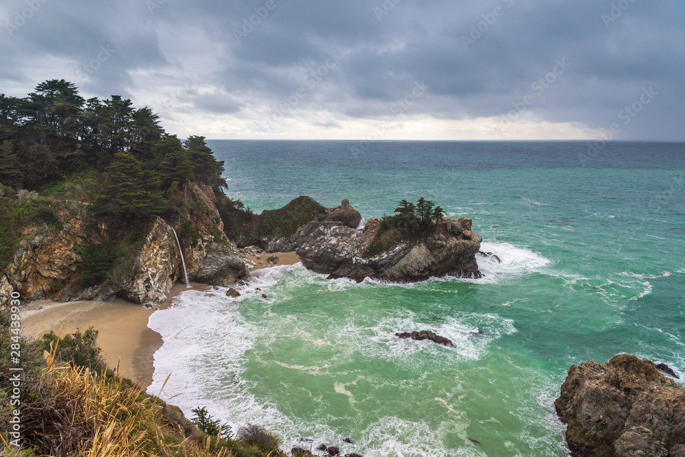 Cove with the Pacific Ocean and McWay Falls in Big Sur