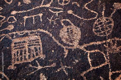 USA, California, Owens Valley. Petroglyphs cover boulder.  photo