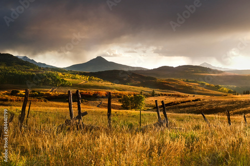 USA, Colorado, San Juan Mountains. Landscape and fence at sunset. Credit as: Marie Bush / Jaynes Gallery / DanitaDelimont.com