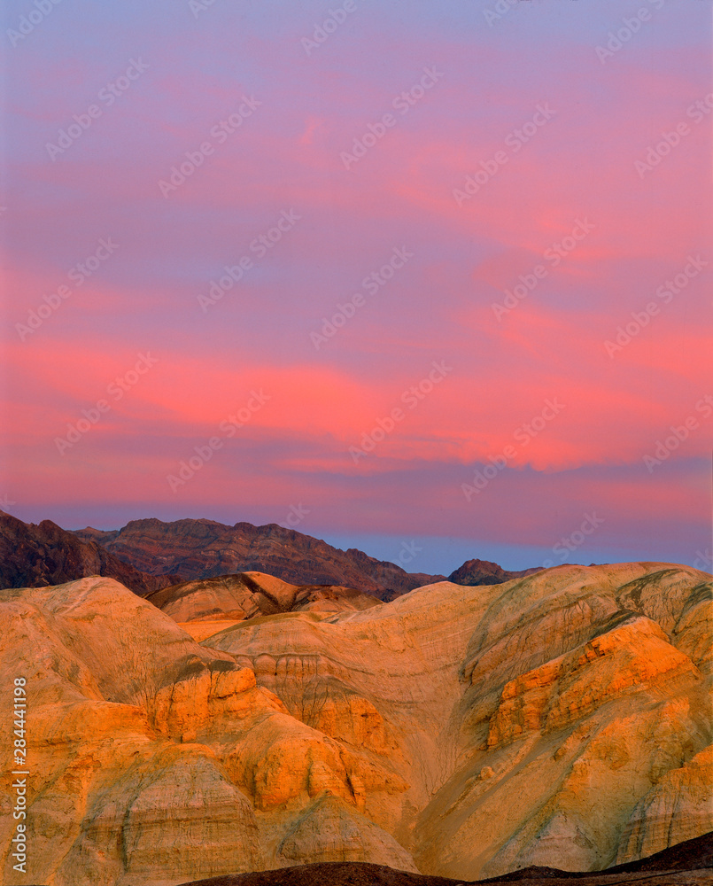 USA, California, Death Valley NP. Sunset offers a variety of colors both in the sky and the sand at Zabriskie Point, Death Valley NP, California.
