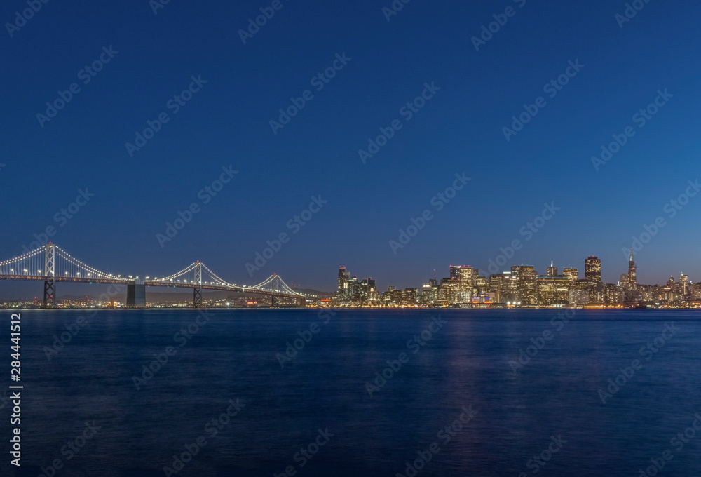 USA, California, San Francisco, Bay Bridge & Downtown Skyline at Twilight