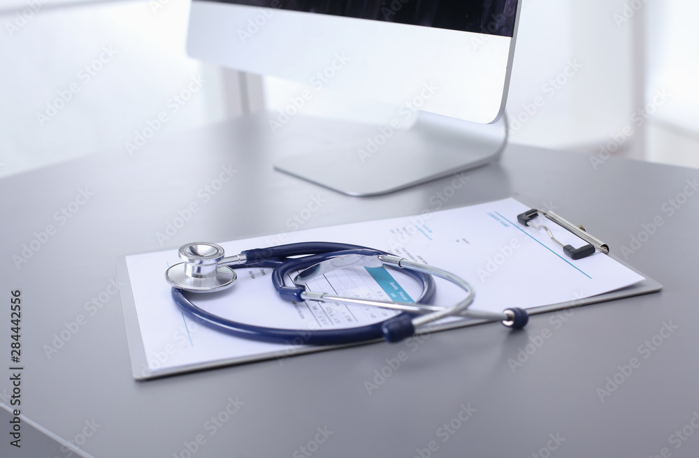 Medical equipment: blue stethoscope and tablet on white background. Medical equipment Medical equipment: blue stethoscope and tablet on white background. Medical equipment