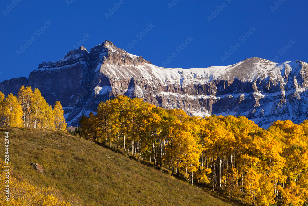 USA, Colorado, San Juan Mountains. Mountain and autumn-colored forest. 