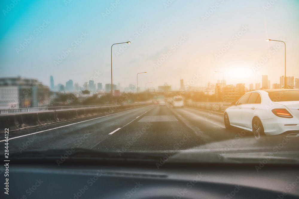 Car Driving on road and Small passenger car seat on the road used for daily trips