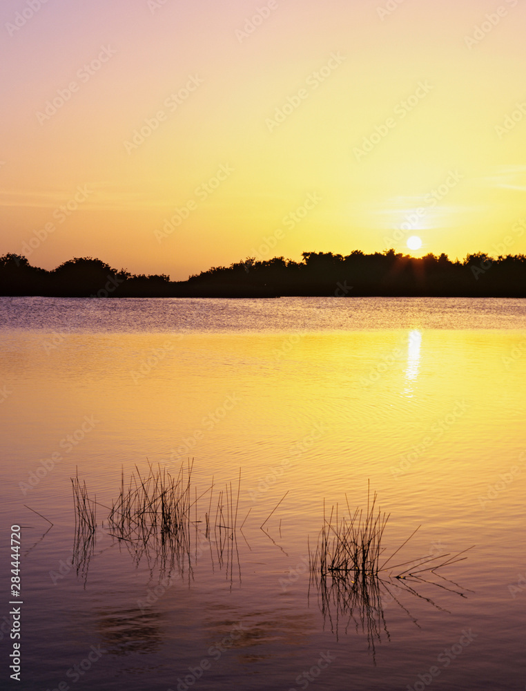 USA, Florida, Everglades National Park. Sunset reflection on lake. 
