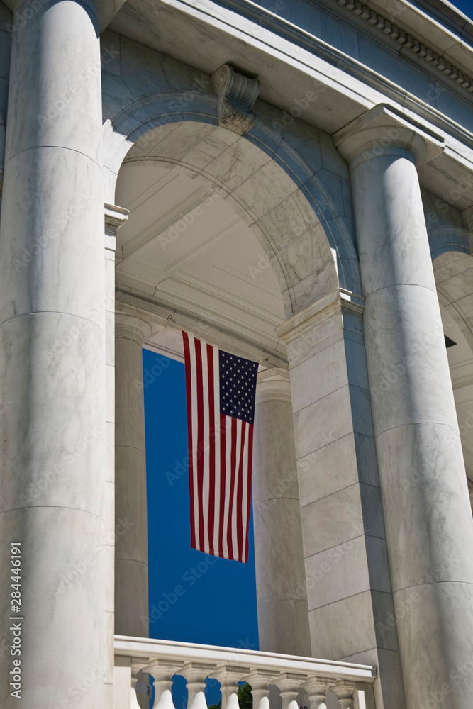 Obraz premium USA, VA, Arlington. American Flags are hung around the Ampitheater located adjacent to the Tomb of the Unknown Soldier at Arlington National Cemetery.