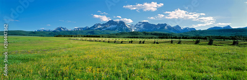 USA  Idaho  Sawtooth NRA. A split-rail fence extends to the Sawtooth Range at Sawtooth NRA  Idaho.