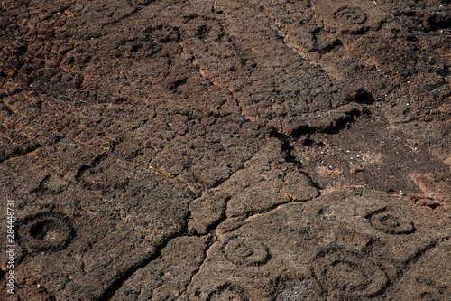 USA, Hawaii, Big Island. Petroglyphs made in black lava. 