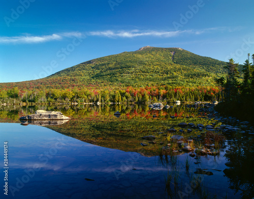USA, Maine, Baxter State Park, South Turner Mountain with early autumn color reflects in Sandy Stream Pond.