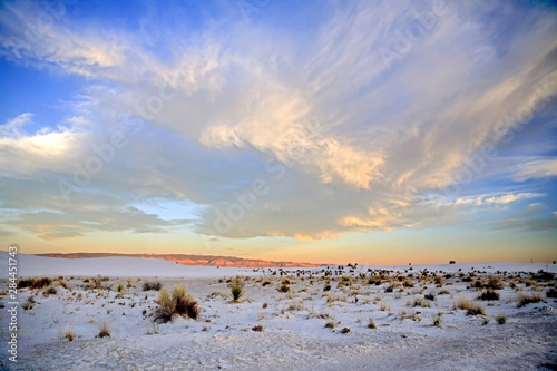 USA, New Mexico, White Sands National Monument situated in the Tularosa Basin of New Mexico offers vistas of wave-like dunes of gypsum sand in the heart of the world's largest gypsum dune field. photo