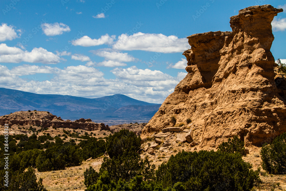 Santa Fe to Taos, New Mexico. Butte and the Sangre de Cristo Mountains on I-40 E, between Santa Fe to Taos