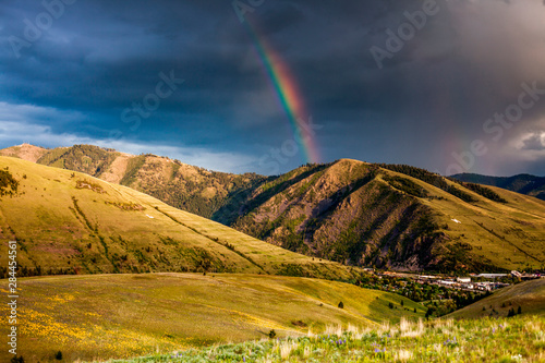 Rainbow at sunset over Hellgate Canyon in Missoula, Montana photo