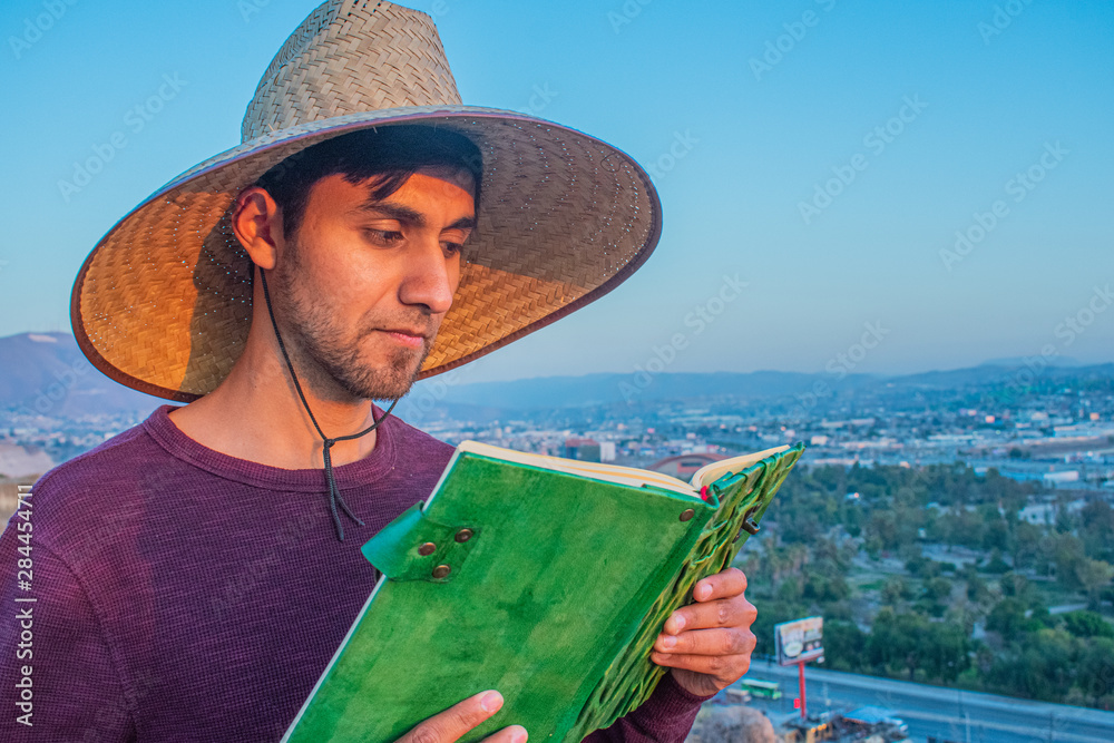 Fototapeta premium adventurers reading a mystical green book