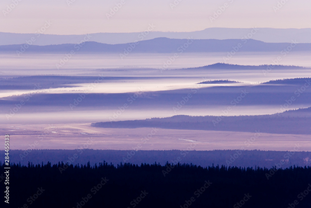 USA, Oregon, Crater Lake National Park. Purple haze hangs over valley. 