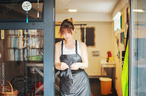 portrait of professional pet hairdresser hipster woman