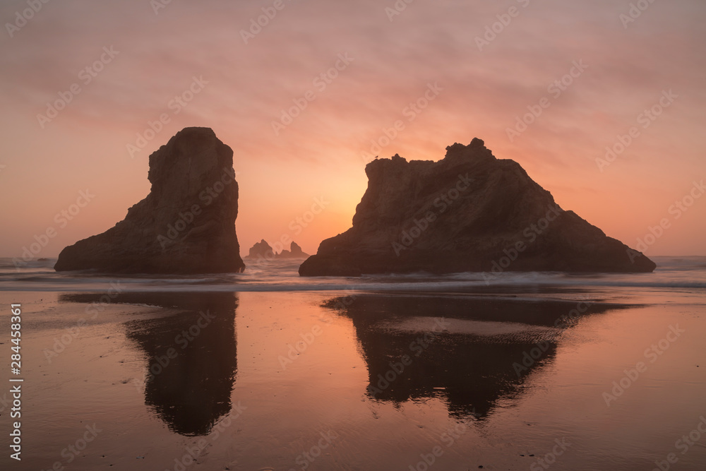 USA, Oregon, Bandon Beach. Sea stacks silhouetted at sunset. 