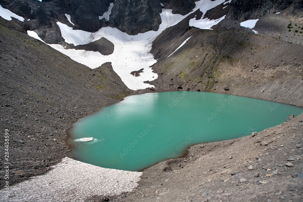 USA, Oregon, Three Fingered Jack. A glacial tarn collects runoff from Three Fingered Jack in the Cascades Range of Oregon. USA, Oregon, Three Fingered Jack. A glacial tarn collects runoff from Three Fingered Jack in the Cascades Range of Oregon.