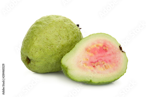 whole and half pink guava fruit isolated on white background