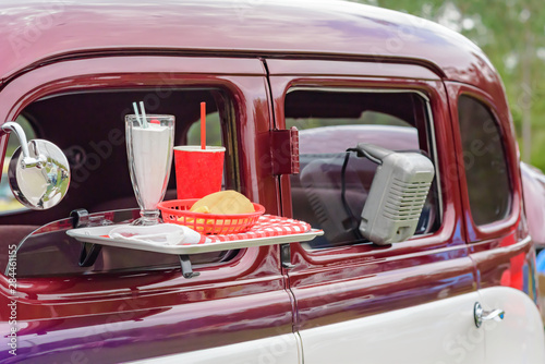 Classic car at drive in movie theater photo