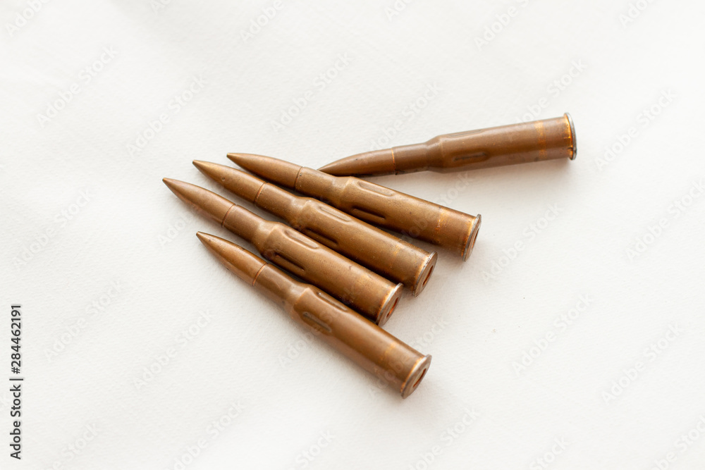 ammunition for a firearm machine gun on white background ammunition for a firearm machine gun on white background