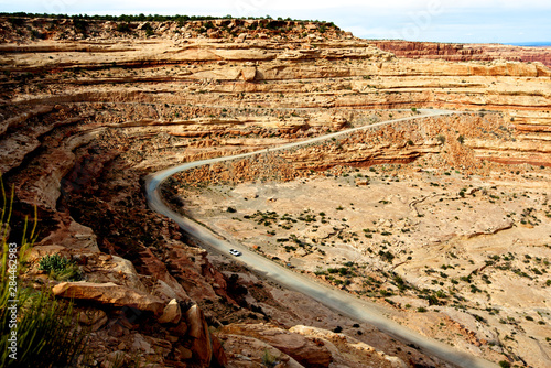 On Utah Route 261 the Moki Dugway drops 1200 feet at an 11 percent grade in 3 miles of gravel road, dropping off Cedar Mesa to the San Juan River valley. A few scant pullouts offer stunning views photo