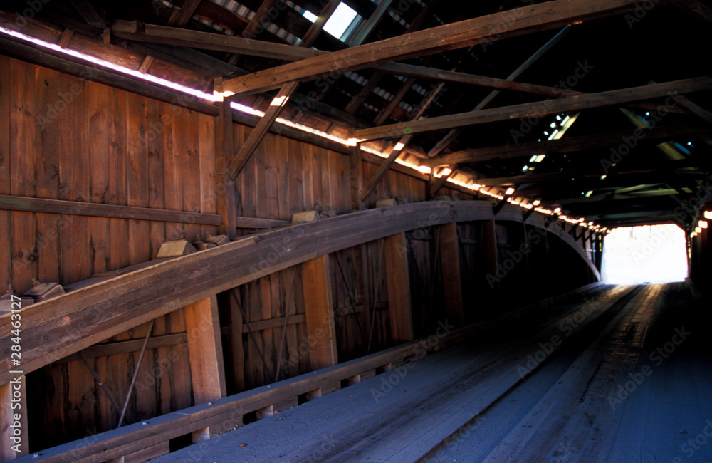 North America, United States, Vermont, Woodstock. A view of inside the Lincoln Covered Bridge built in 1877 in the Pratt Truss style.