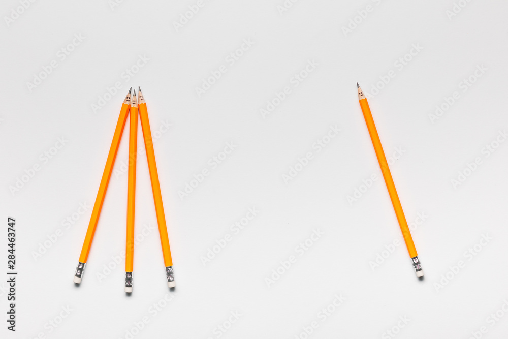 Some pencils with little smiley faces on white background , shot from above. Some pencils with little smiley faces on white background , shot from above.