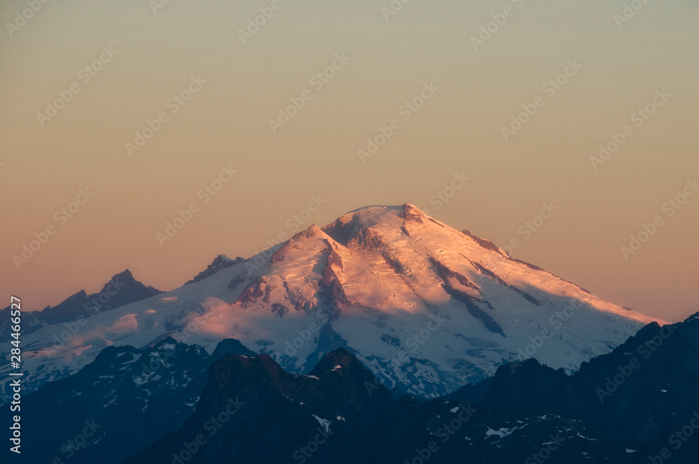 USA, Washington State, North Cascades. Mount Baker at sunrise, as seen from Lookout Mountain summit.