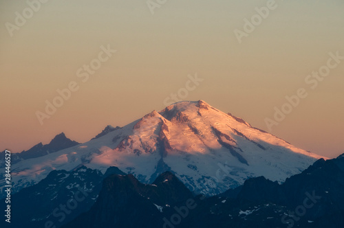 USA, Washington State, North Cascades. Mount Baker at sunrise, as seen from Lookout Mountain summit.