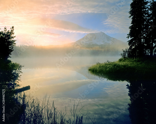 USA, Washington State, Mt Adams. Morning mist on Takhlakh Lake almost hides Mt Adams, Washington State.