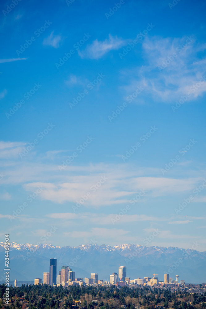 USA, Washington State. Seattle skyline and Olympic Mountains viewed from Bellevue.