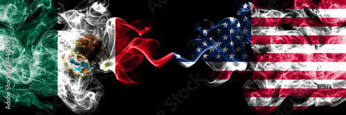 Mexico vs United States of America, American smoky mystic flags placed side by side. Thick colored silky abstract smokes banner of Mexican and United States of America, American photo