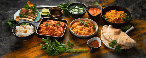 Assorted indian food on black background..