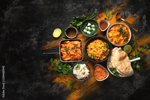 Assorted indian food on black background..