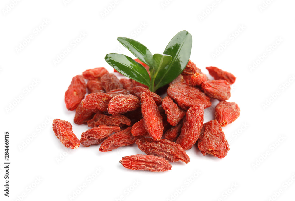 Pile of dried goji berries and leaves on white background Pile of dried goji berries and leaves on white background