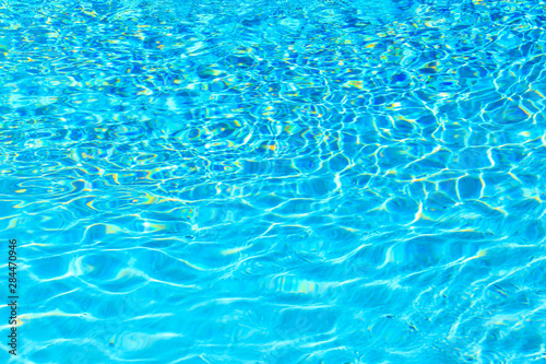 Reflections and patterns of light in a swimming pool.