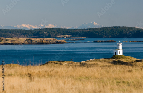 USA, WA, San Juan Islands. Cattle Point light with superb vistas of Lopez Island and Cascade Mountains on mainland Washington.