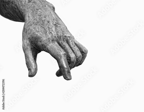 hand. fragment of ancient sculpture. antique sculpture Arm on white background. sculpture statue hand extended points down. white-black color. copy space. 
