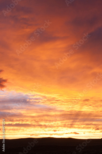 Wyoming, Sublette County, Landscape of sunset over silhouetted ridgeline. photo