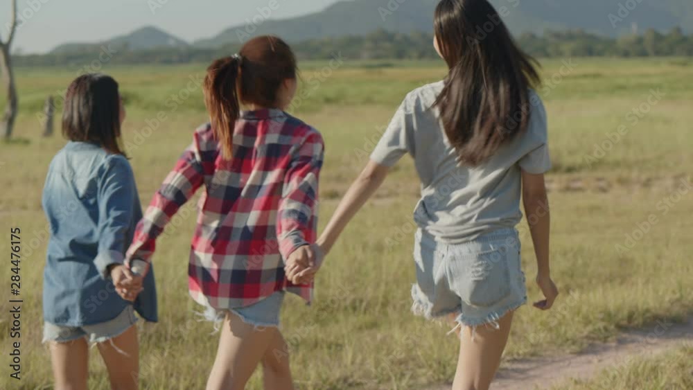 Three young Asian women running having fun together a summer traveling. Group of a young Asian woman lifestyle friend travels holiday. Three young Asian women running having fun together a summer traveling. Group of a young Asian woman lifestyle friend travels holiday.