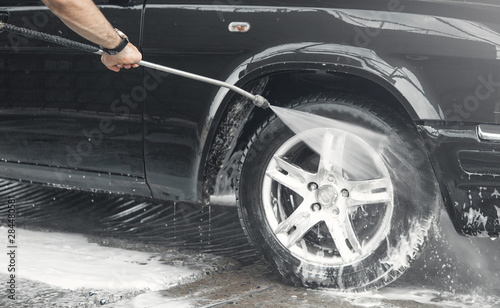 Car washing. The washing process on a self service car wash