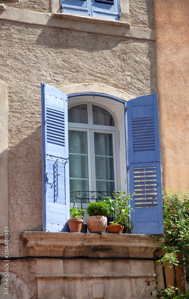 House Facade With Wooden Shutters In Provence