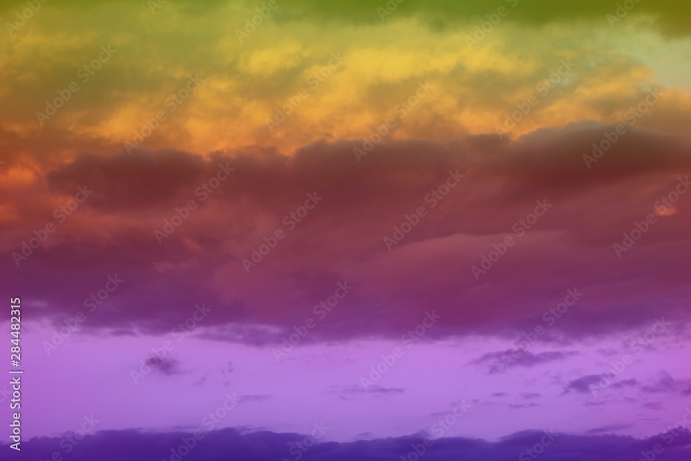 Obraz premium lovely unreal vivid fantasy sun colored cloudy sky for using in design as background.