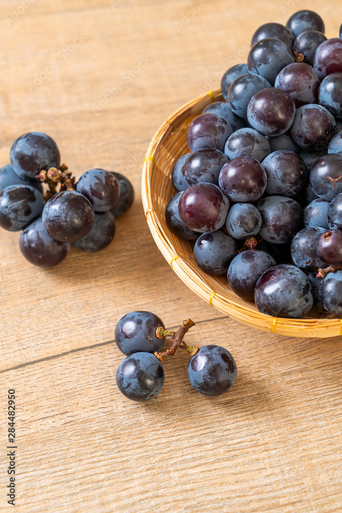 fresh black grapes on white background fresh black grapes on white background