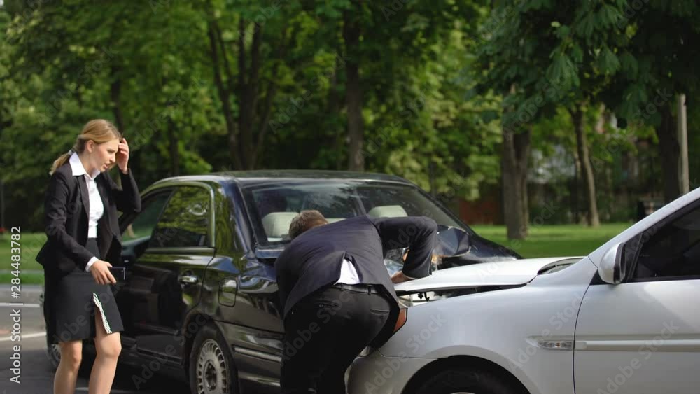 Woman throwing money, male driver proposing compensation for car repair, crash Woman throwing money, male driver proposing compensation for car repair, crash