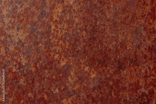 Old iron rusty surface with a new screw