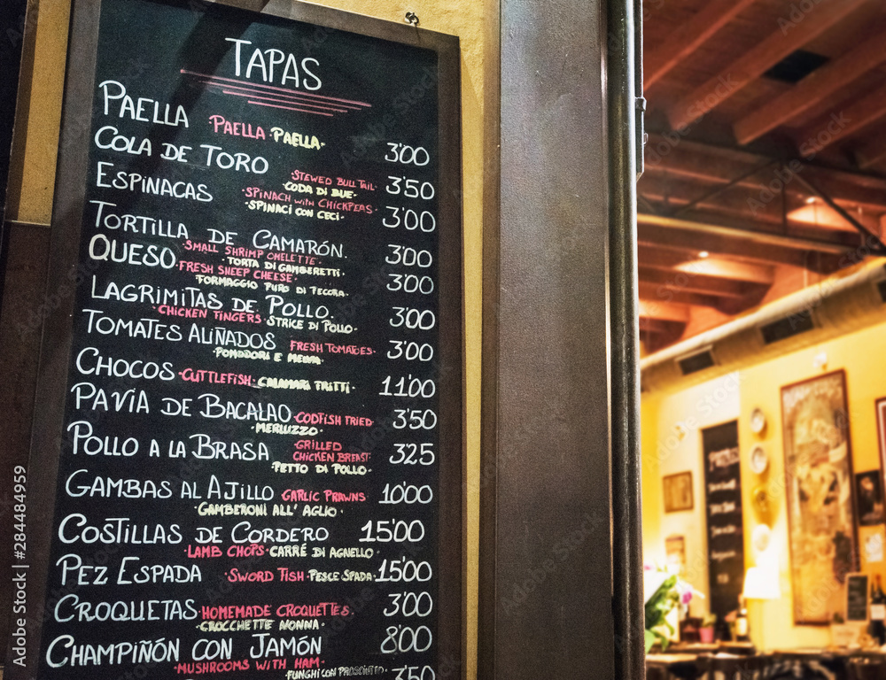 Fototapeta premium Tapas bar in Spain. Spanish tapas bar in historical center of Seville at night