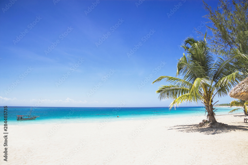 Tropical beach with white send and beautiful sky