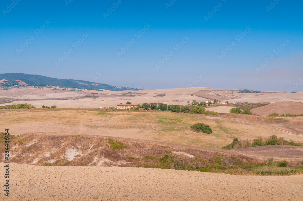 Countryside landscape with barren fields and dry soil