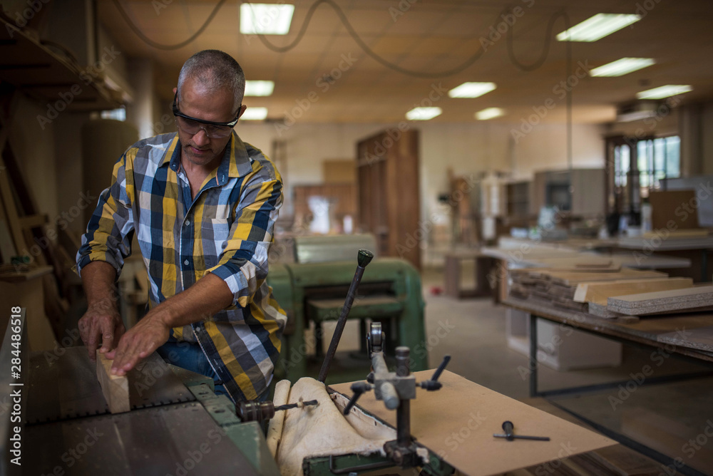 the master uses a woodworking machine the master uses a woodworking machine
